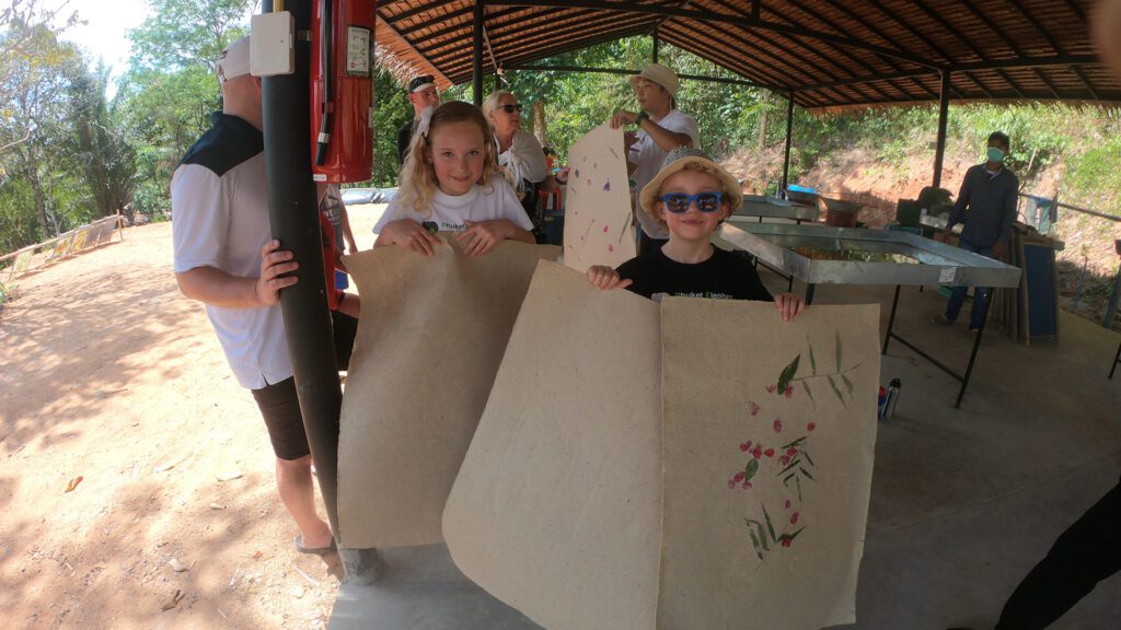 Kids with elephant dung recycled paper