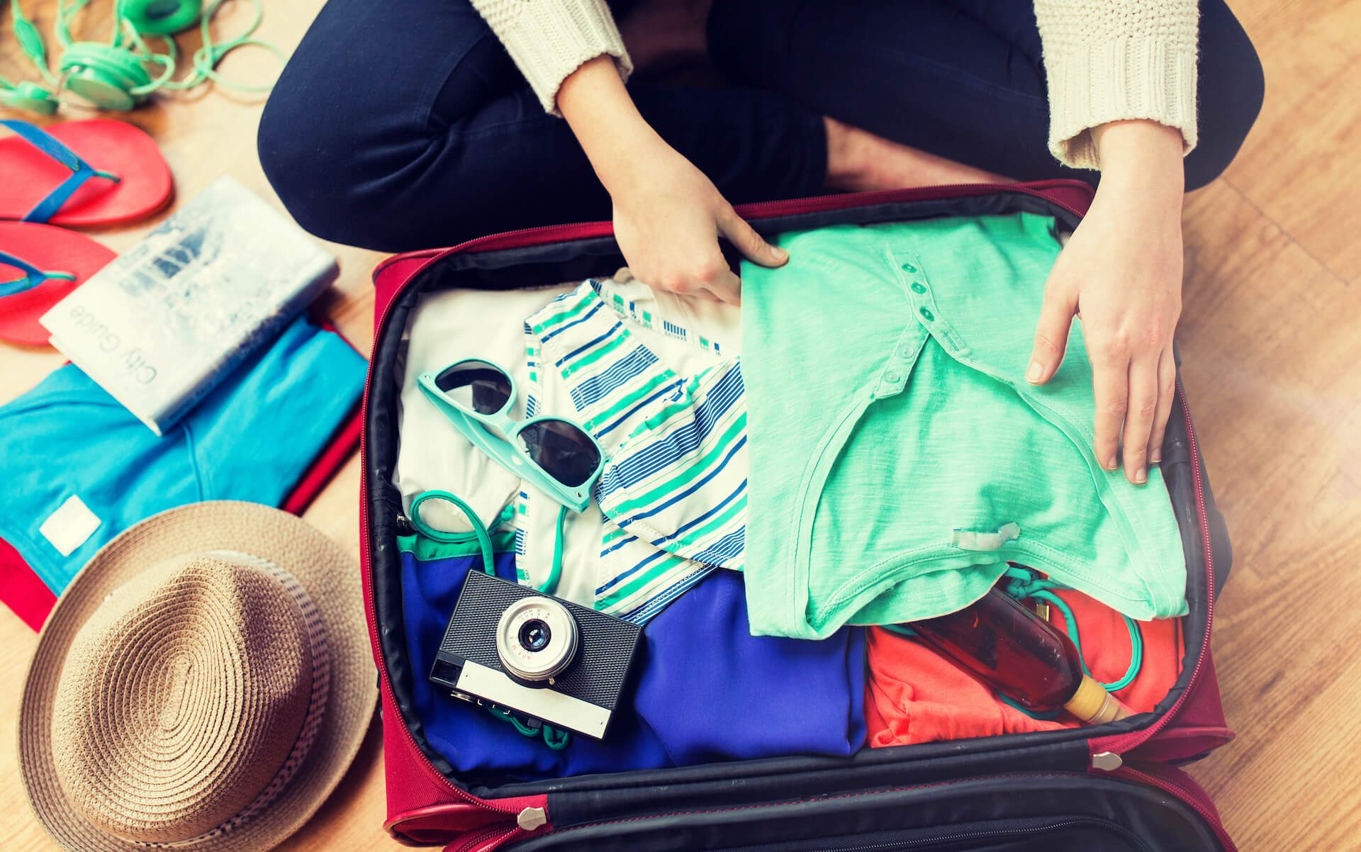 woman packing travel bag
